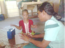 Child learning sign language in Samoa